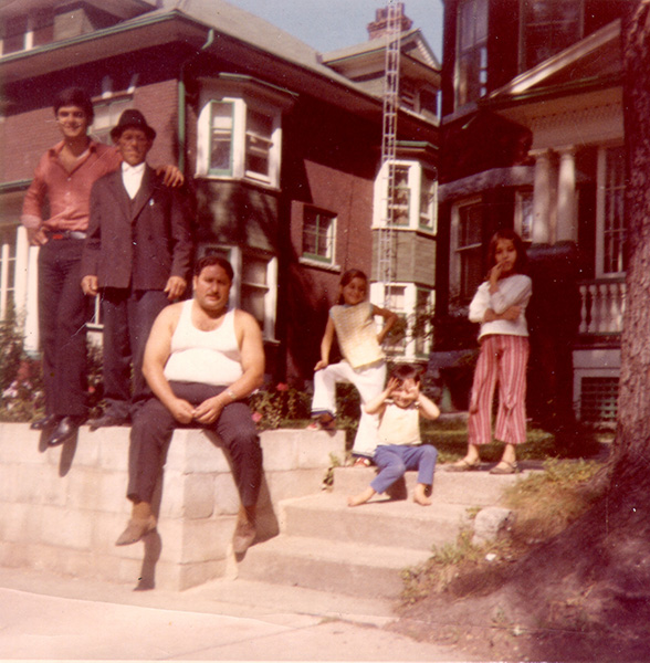 family in front of home before colour correction
